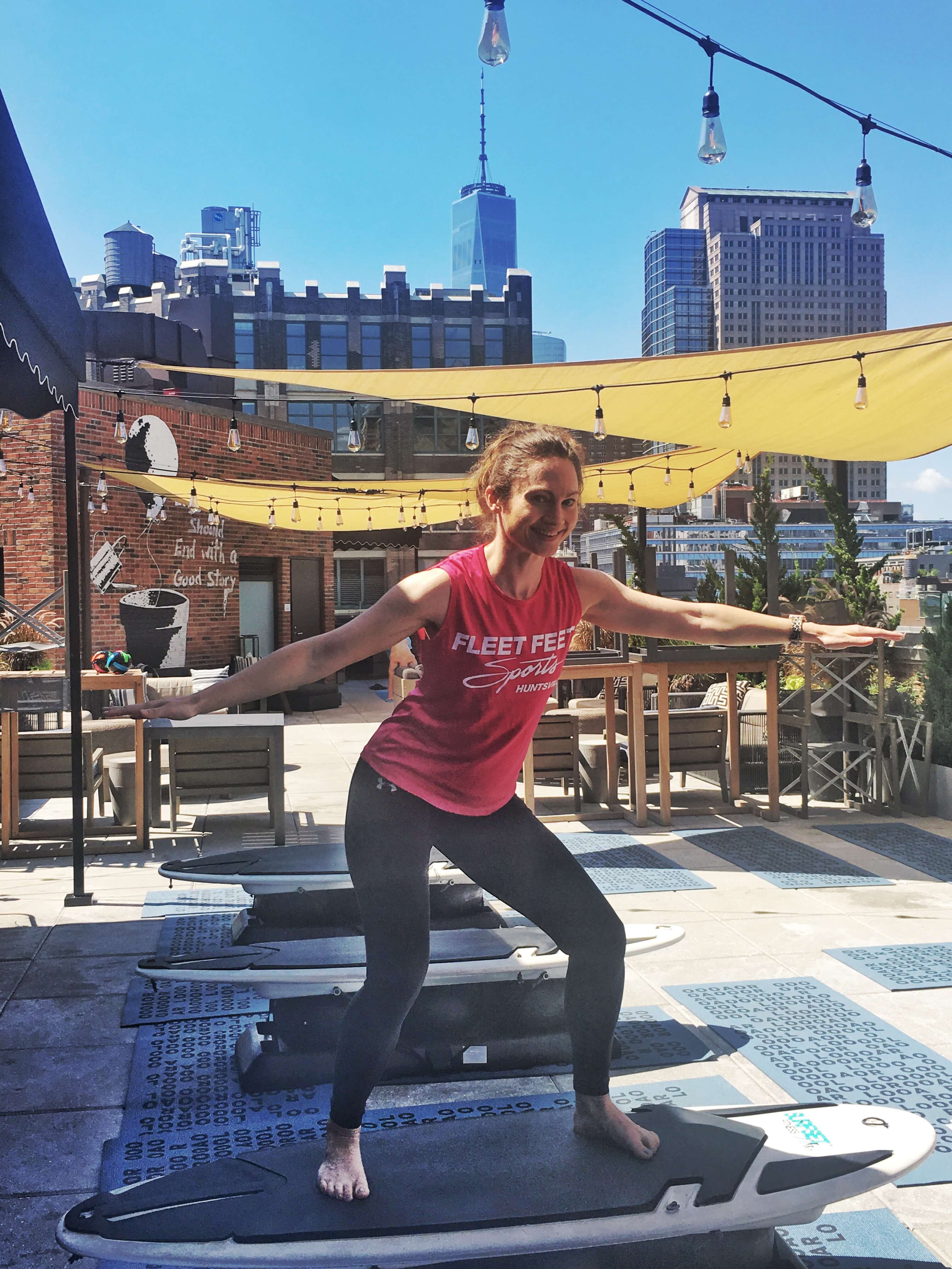 Surfset surfboard rooftop yoga top NYC workout - fitness studio on ClassPass - Stay in shape while traveling